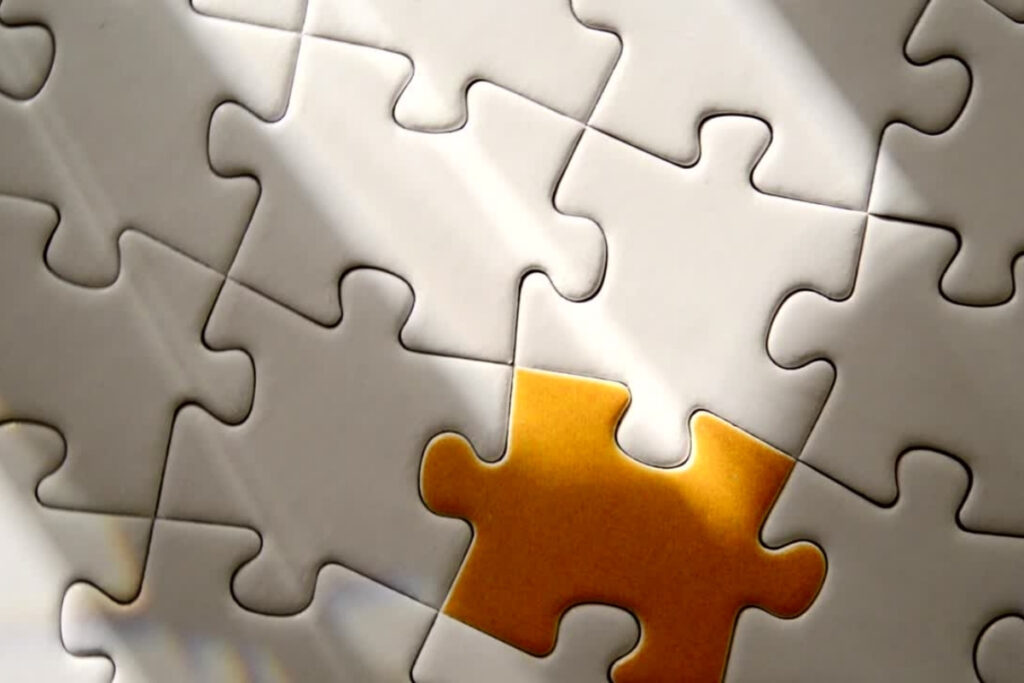 jigsaw with one orange piece